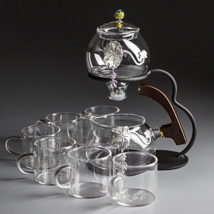 https://www.healthwisdom.shop/cdn/shop/files/Creative-Silver-Inlaid-Semi-automatic-Tea-Set-Heat-resistant-Glass-Kung-Fu-Tea-Set-Teapot-Teacup-3_700x700.jpg?v=1701549508